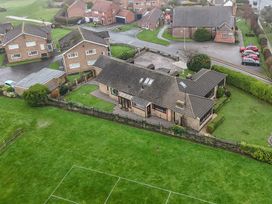 An aerial view of a residential area with houses and a garden at Seacrest Lodge in Scarborough