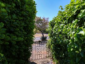 A view of a garden gate surrounded by hedges at Seacrest Lodge in Scarborough