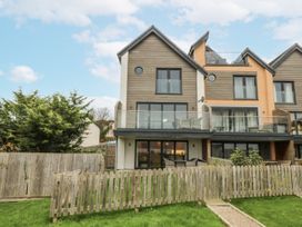 A house with a balcony and garden at Estuary View in Colwyn Bay