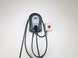 An EV charger mounted on a wall at Curradoon House in Touraneena, County Waterford