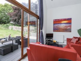 A living room with a window and seating at Budmouth in Upwey near Weymouth
