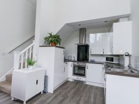 A kitchen with cabinets and appliances at Budmouth Upwey near Weymouth