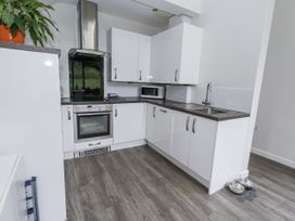 A kitchen with cabinets and appliances at Budmouth in Upwey near Weymouth