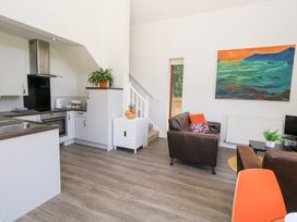 A kitchen and living area with furniture at Shepherd Oak Upwey near Weymouth