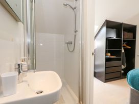 A bathroom with shower and sink at Shepherd Oak in Upwey near Weymouth