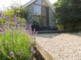 A garden with lavender and a seating area at Shepherd Oak in Upwey near Weymouth