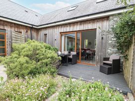 A garden area with seating and plants at Everdene Upwey near Weymouth