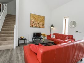 A living room with a sofa and coffee table at Everdene, Upwey near Weymouth