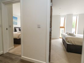 A hallway view of two bedrooms at Everdene in Upwey near Weymouth