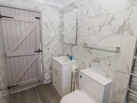 A bathroom with a sink and toilet at Corner Cottage in Broad Haven