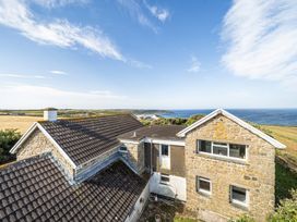 A house with a view of the ocean and landscape at Tregiffian Vean Sennen Cove