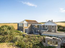 An exterior view of a house with a garden at Tregiffian Vean Sennen Cove