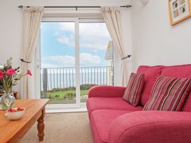 A living room with a sofa and coffee table at The Lookout in Sennen