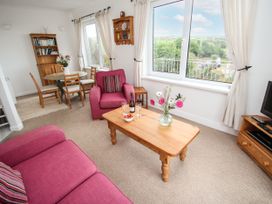 A living room with a coffee table and sofa at The Lookout in Sennen