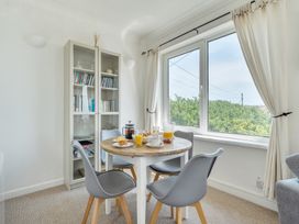 A dining room with a table and chairs at The Lookout Sennen