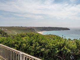 A view of a beach and sea from a cliff at The Lookout in Sennen