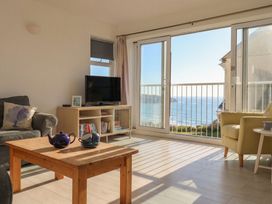 A living room with a view of the sea at Brook House in Sennen Cove near St Just