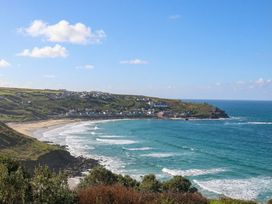 A coastal view with beach and hills at Brook House in Sennen Cove near St Just