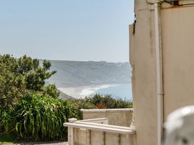 A view of the ocean and beach from a property at Brook House in Sennen Cove near St Just