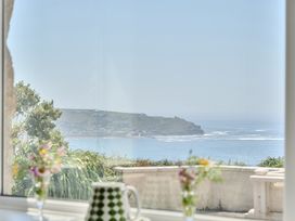 A coastal view from a living room window at Brook House in Sennen Cove near St Just