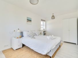 A bedroom with a bed and bedside table at Brook House Sennen Cove near St Just