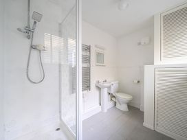 A bathroom with shower, toilet, and sink at Brook House Sennen Cove near St Just
