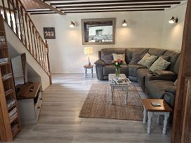 A living room with a sofa and coffee table at Owl's Nest in South Molton