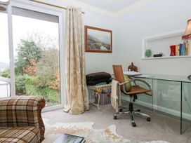 An office with a desk, chair, and window at Kempton in Bowness-on-Windermere