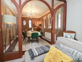 A dining room with a table and chairs at Kempton in Bowness-on-Windermere