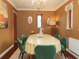 A dining room with a table and chairs at Kempton in Bowness-on-Windermere