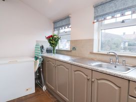 A kitchen with a freezer and sink at The Farmhouse in Boggle Hole near Robin Hood's Bay