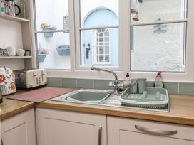 A kitchen with a sink and toaster at Dolfor in Nefyn