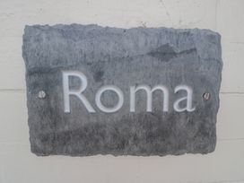 A plaque with the text Roma at Roma in Rhos-on-Sea
