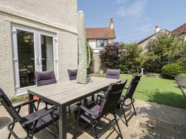 A patio with table and chairs at Roma in Rhos-on-Sea