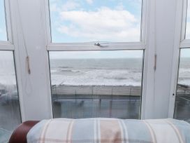 A view of the ocean from a window in a living room at The View in Criccieth