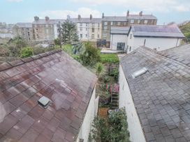 A view showing rooftops, plants, and a courtyard at The View in Criccieth