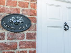 An entryway with a nameplate and door at Croft View in Fylingthorpe near Robin Hood's Bay