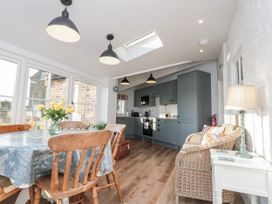 A dining room with a table and chairs at Croft View in Fylingthorpe near Robin Hood's Bay