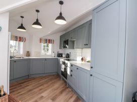 A kitchen with cabinets and appliances at Croft View in Fylingthorpe near Robin Hood's Bay