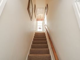 A staircase leading to a window at Croft View in Fylingthorpe near Robin Hood's Bay