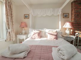 A bedroom with a bed and lamps at Croft View in Fylingthorpe near Robin Hood's Bay