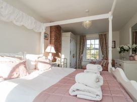 A bedroom with a bed and window at Croft View in Fylingthorpe near Robin Hood's Bay