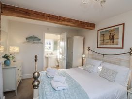 A bedroom with a bed and dresser at Croft View in Fylingthorpe near Robin Hood's Bay