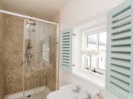 A bathroom with a shower and sink at Croft View in Fylingthorpe near Robin Hood's Bay
