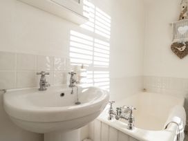 A bathroom with a sink and bathtub at Croft View in Fylingthorpe near Robin Hood's Bay