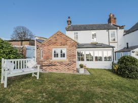 A house with a garden and bench at Croft View in Fylingthorpe near Robin Hood's Bay
