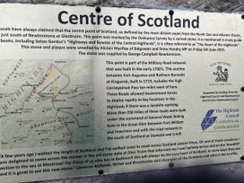 Centre of Scotland information plaque at Wildcat Lodge in Newtonmore