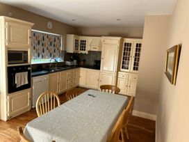 A kitchen with a dining table and chairs at The Sanctuary in Killavullen near Mallow