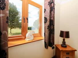 A room with a window and curtains at The Annexe in Litcham