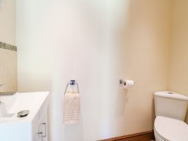 A bathroom with a sink and toilet at The Annexe in Litcham